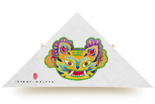 White delta kite with colorful tiger face illustration by artist Gabby Malpas, featuring vibrant florals and chinoiserie style